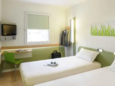 Un ou plusieurs lits dans un hébergement de l'établissement ibis budget Lyon Sud St Genis Laval