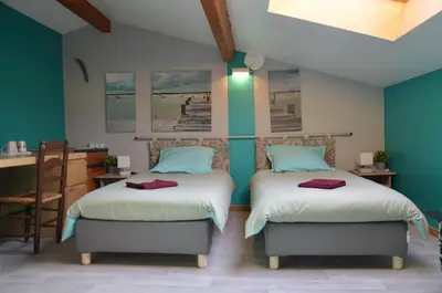 Un ou plusieurs lits dans un hébergement de l'établissement Studio et colocation - Gîte Les 7 fontaines