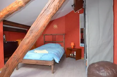 Un ou plusieurs lits dans un hébergement de l'établissement Studio et colocation - Gîte Les 7 fontaines