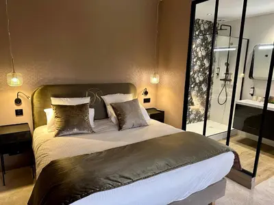 Un ou plusieurs lits dans un hébergement de l'établissement Domaine de Suzel Hôtel & Spa