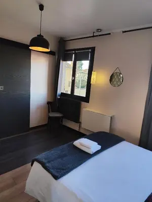 Un ou plusieurs lits dans un hébergement de l'établissement Hotel de la Place