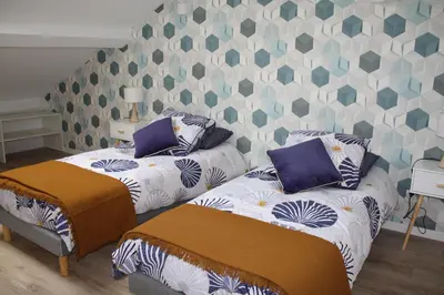 Un ou plusieurs lits dans un hébergement de l'établissement Duplex Bastié T3 calme et climatisé WiFi