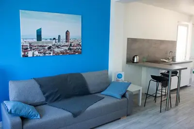 Coin salon dans l'établissement Maisonnette avec jardin, parc du chêne (tram T5)