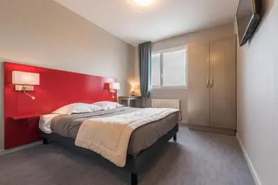 Un ou plusieurs lits dans un hébergement de l'établissement Hôtel L'Horizon - Restaurant La Fougassette