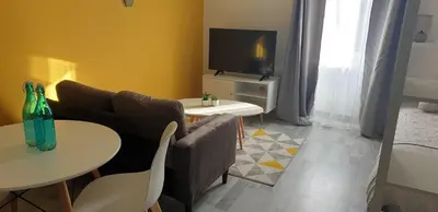Télévision ou salle de divertissement dans l'établissement Appartements entiers proche Aéroport - ZAC Chesnes - CNPE du Bugey Check-In 24h7J