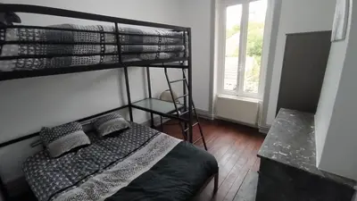 Un ou plusieurs lits dans un hébergement de l'établissement Appart - Hotel La Batisse de Saint-Chamond