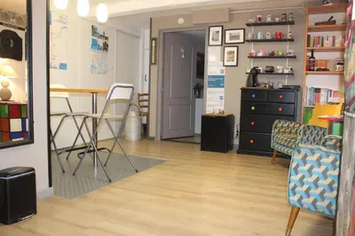 Coin salon dans l'établissement Chambres au grand calme dans maison