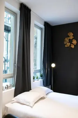 Un ou plusieurs lits dans un hébergement de l'établissement Le St Germain - Pétillant studio décoré avec goût en centre-ville