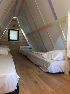 Un ou plusieurs lits dans un hébergement de l'établissement Ô TIPI LODGE