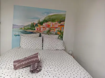 Un ou plusieurs lits dans un hébergement de l'établissement Studio de Jardin 