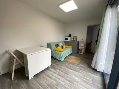 Un ou plusieurs lits dans un hébergement de l'établissement Studio de Jardin 
