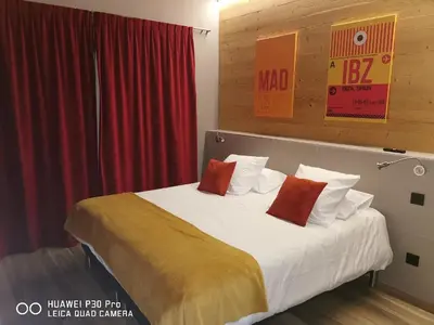 Un ou plusieurs lits dans un hébergement de l'établissement World Hotel