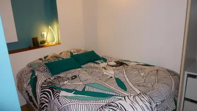 Un ou plusieurs lits dans un hébergement de l'établissement Appartement tout équipé avec piscine proche Stade OL et EUREXPO