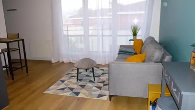 Coin salon dans l'établissement Appartement tout équipé avec piscine proche Stade OL et EUREXPO