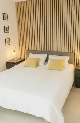 Un ou plusieurs lits dans un hébergement de l'établissement Chambres cosy proche cnpe Bugey - via rhona
