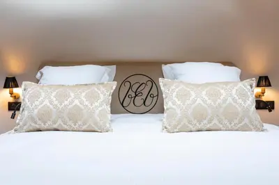 Un ou plusieurs lits dans un hébergement de l'établissement Hôtel Villa Alexandre