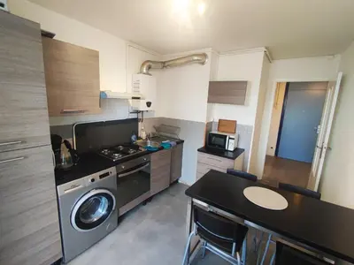 Cuisine ou kitchenette dans l'établissement L'appart de la tour T4