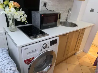 Cuisine ou kitchenette dans l'établissement Joli studio tout confort avec toutes commodités
