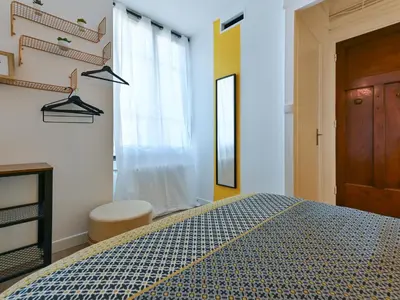 Un ou plusieurs lits dans un hébergement de l'établissement LE DEDIEU - HYPERCENTRE GARAGE GRATUIT WiFi NETFLIX AMAZON PRIME