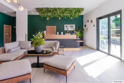 Coin salon dans l'établissement KYRIAD LYON OUEST Limonest