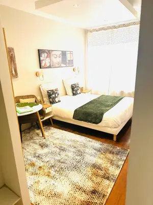 Un ou plusieurs lits dans un hébergement de l'établissement Studio ZEN cosy gare part dieu