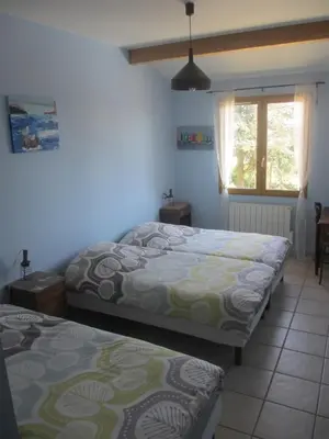 Un ou plusieurs lits dans un hébergement de l'établissement Gîte le Chêne du Py