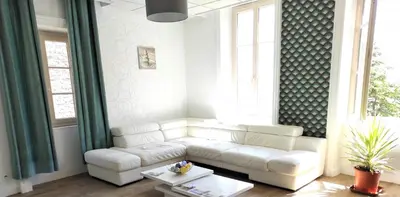 Coin salon dans l'établissement Appartement Cogny - les Meublés des Pierres Dorées