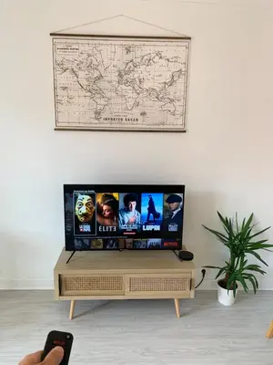 Télévision ou salle de divertissement dans l'établissement Le Châteaucreux - Cosy & SPA