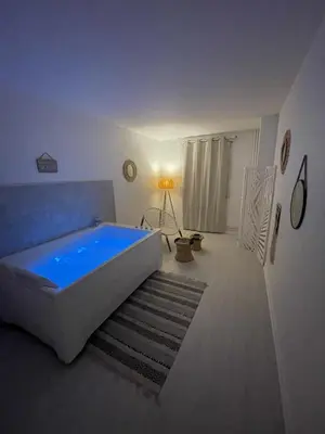 Un ou plusieurs lits dans un hébergement de l'établissement Le Châteaucreux - Cosy & SPA