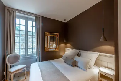 Un ou plusieurs lits dans un hébergement de l'établissement Château de Champ-Renard
