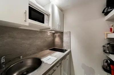 Cuisine ou kitchenette dans l'établissement Le Petit Change - Studio tout équipé à Lyon AIL