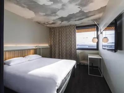 Un ou plusieurs lits dans un hébergement de l'établissement ibis Lyon Est Meyzieu