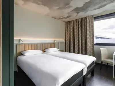 Un ou plusieurs lits dans un hébergement de l'établissement ibis Lyon Est Meyzieu