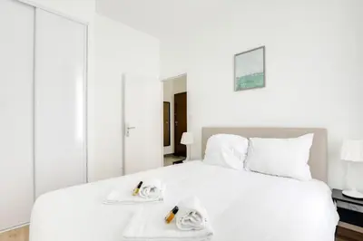 Un ou plusieurs lits dans un hébergement de l'établissement GuestReady - 1chambre, 5min Gare Part Dieu
