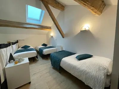 Un ou plusieurs lits dans un hébergement de l'établissement Le Clos Du Jardin