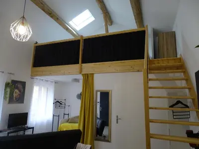Télévision ou salle de divertissement dans l'établissement Le Clos Du Jardin