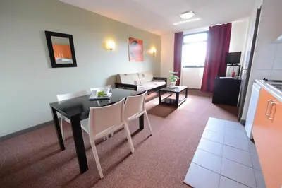 Coin salon dans l'établissement Residhotel Lyon Lamartine