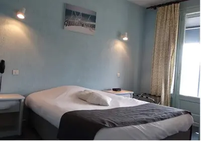 Un ou plusieurs lits dans un hébergement de l'établissement Europa Hotel