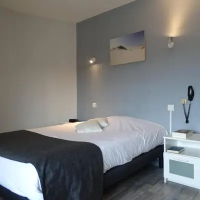 Un ou plusieurs lits dans un hébergement de l'établissement Europa Hotel