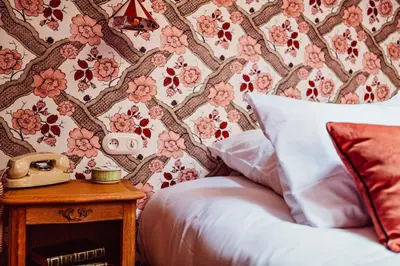 Un ou plusieurs lits dans un hébergement de l'établissement Hôtel Maison Lacassagne Lyon
