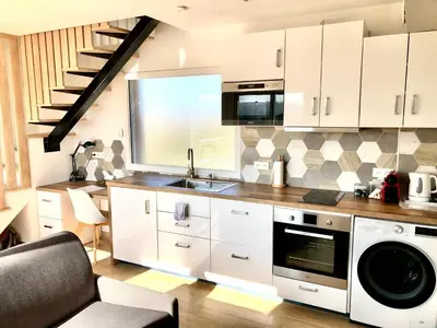 Cuisine ou kitchenette dans l'établissement La Parenthèse Balnéo T2 Cosy de 40m² avec terrasse