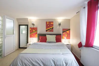 Un ou plusieurs lits dans un hébergement de l'établissement Appartement Indépendant en maison à 15 MIN de LYON