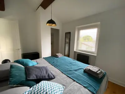 Un ou plusieurs lits dans un hébergement de l'établissement La Petite Maison, jardin et jacuzzi, proche de Lyon