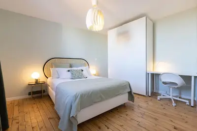 Un ou plusieurs lits dans un hébergement de l'établissement Emeraude, T2 design tout équipé Châteaucreux-Gare