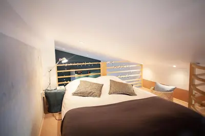 Un ou plusieurs lits dans un hébergement de l'établissement LYONEST chambre d'hôtes
