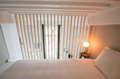 Un ou plusieurs lits dans un hébergement de l'établissement Le Gary - Appartement atypique refait à neuf - A deux pas Parc Tête d'Or