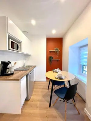 Cuisine ou kitchenette dans l'établissement L'Arizona