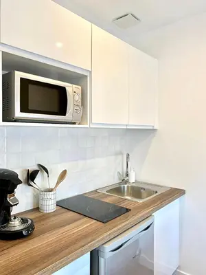 Cuisine ou kitchenette dans l'établissement L'Arizona