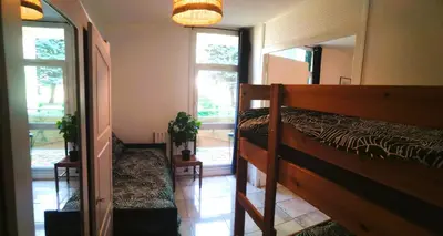 Un ou plusieurs lits dans un hébergement de l'établissement Résidence du parc des Tilleuls de Lyon 82 m2 Pkg free