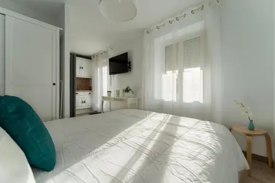 Un ou plusieurs lits dans un hébergement de l'établissement Cocoon Appart 2 Miribel
